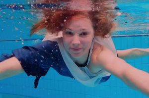 Teenager woman Avenna is swimming in..