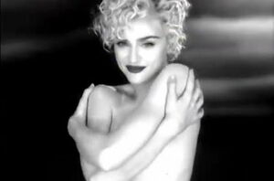 Madonna bare-breasted but stashing her